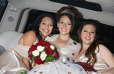 bride and bridesmaids inside of limo